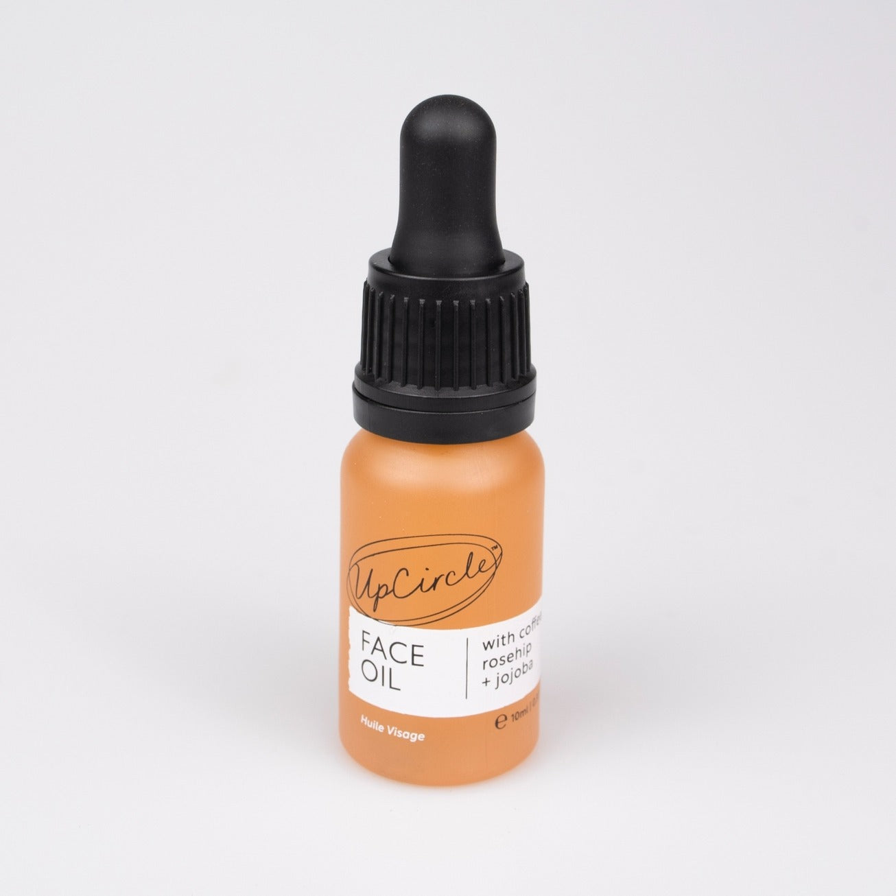 Frasco de 10 ml de óleo facial orgânico com café reciclado e rosa-mosqueta. 10 ml organic face oil bottle with upcycled coffee and rosehip